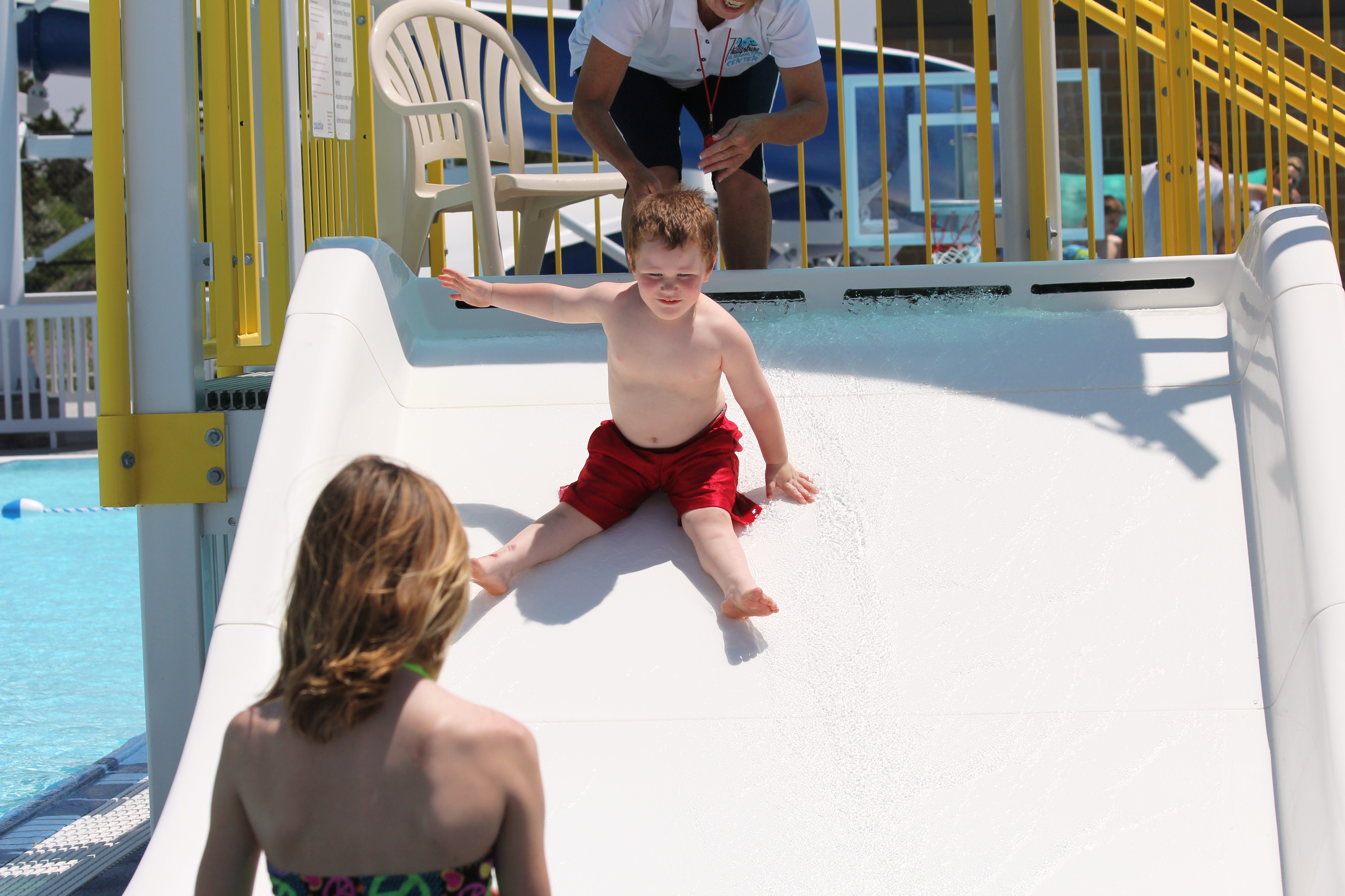 First down the family slide on grand opening day.