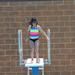 Getting ready to go off the diving board.