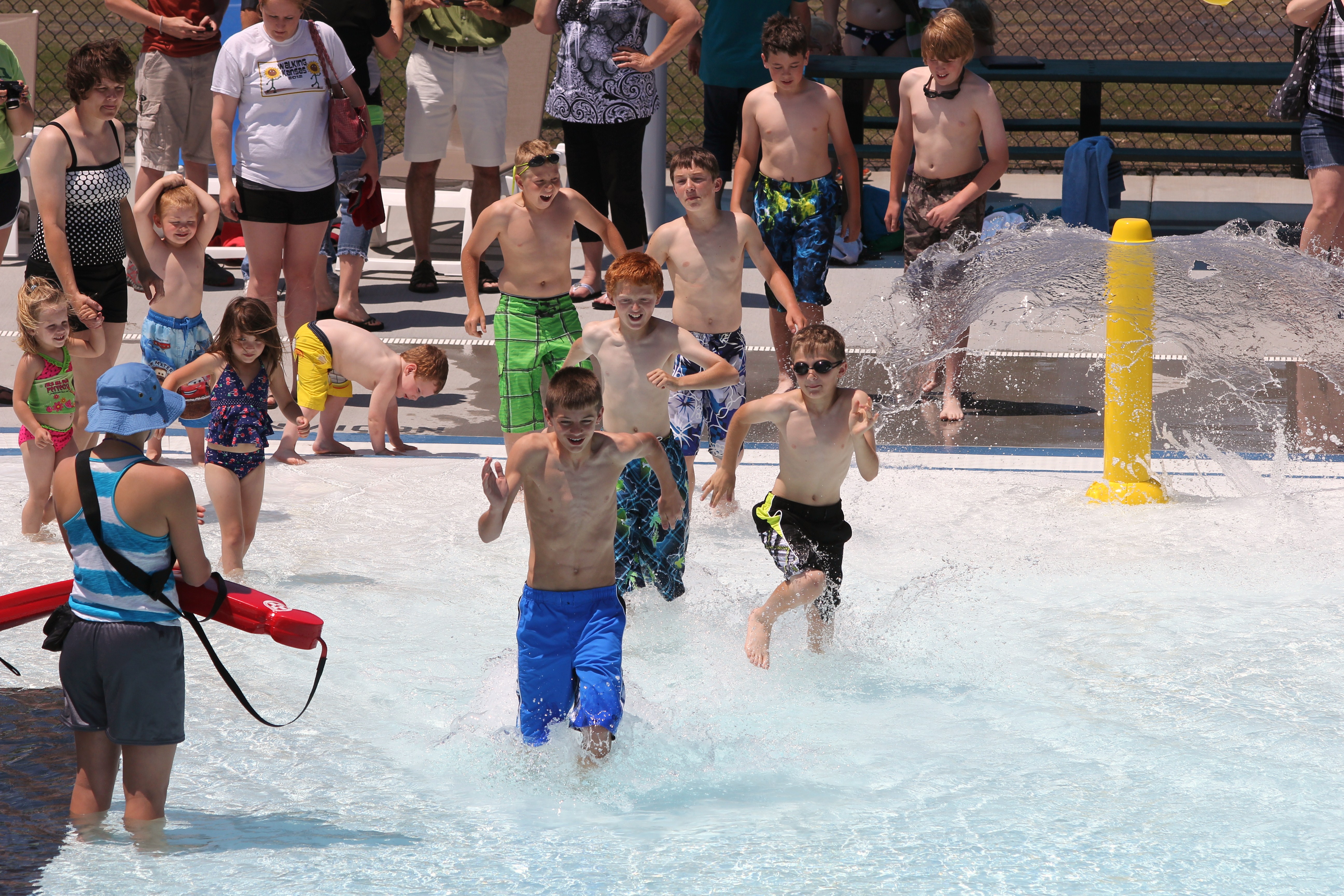 Running to enjoy the pool at grand opening day.